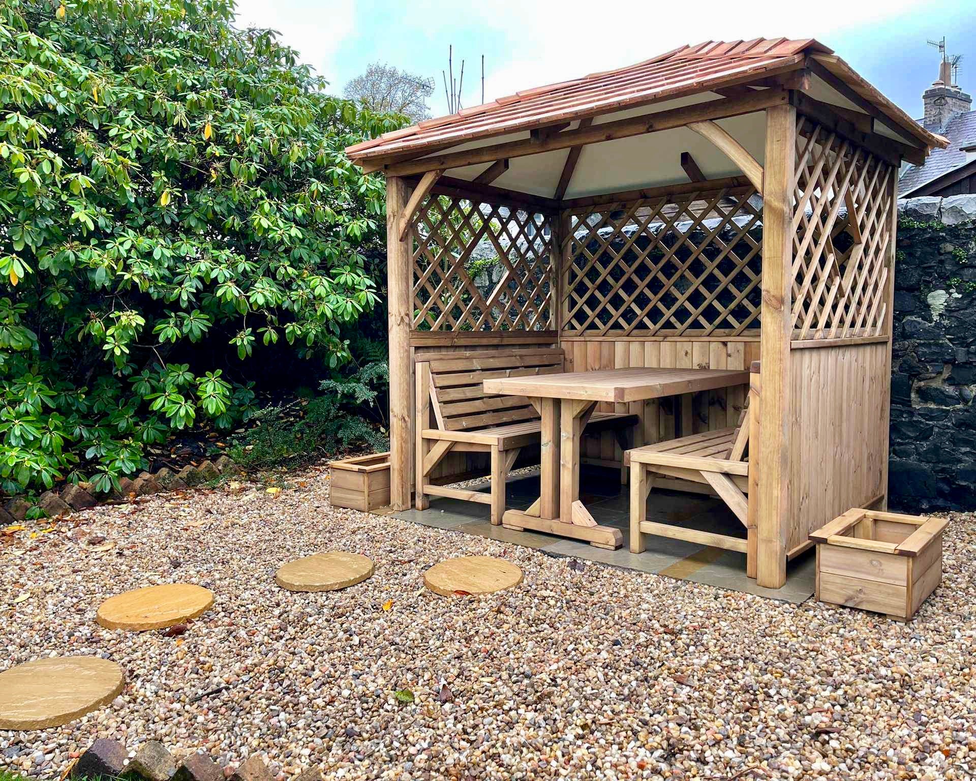 Wooden arbour with cedar shingles