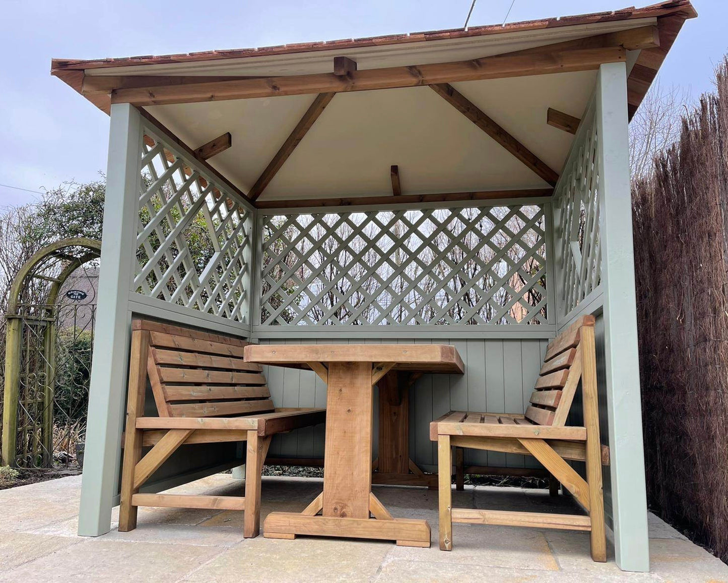 Wooden garden arbour with cedar roof 