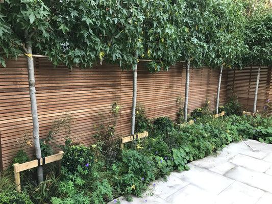 iroko slatted fence panels by duckpaddle
